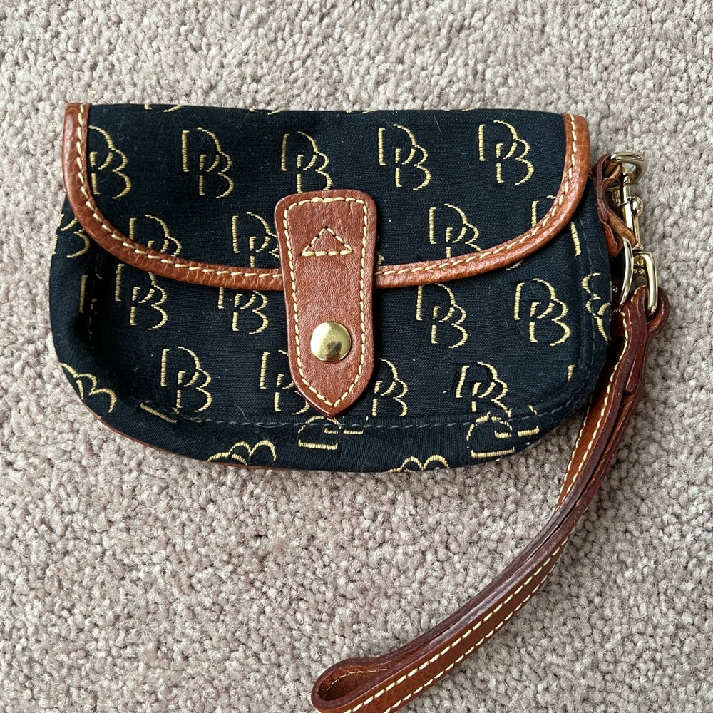 Very gently used vintage Dooney and Bourke flap wristlet